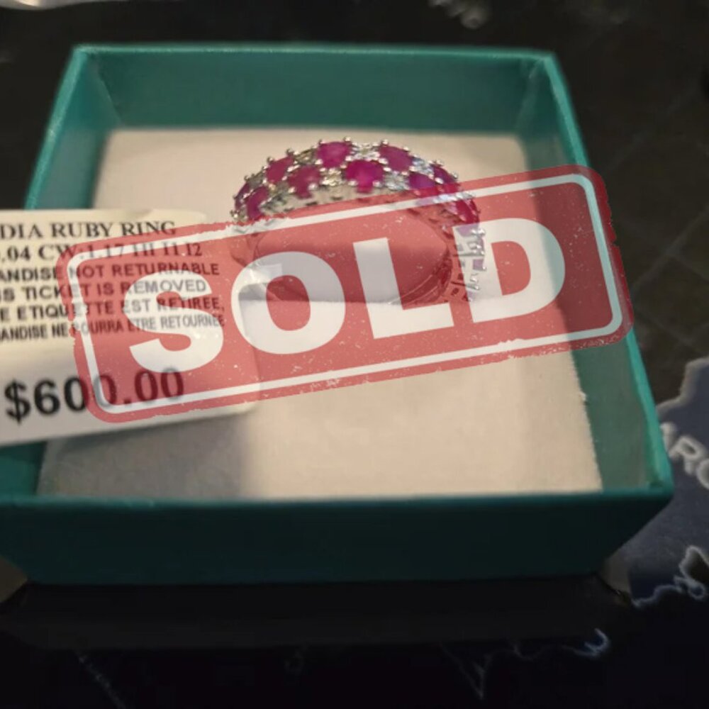 Brand new ring made of ruby's and diamonds